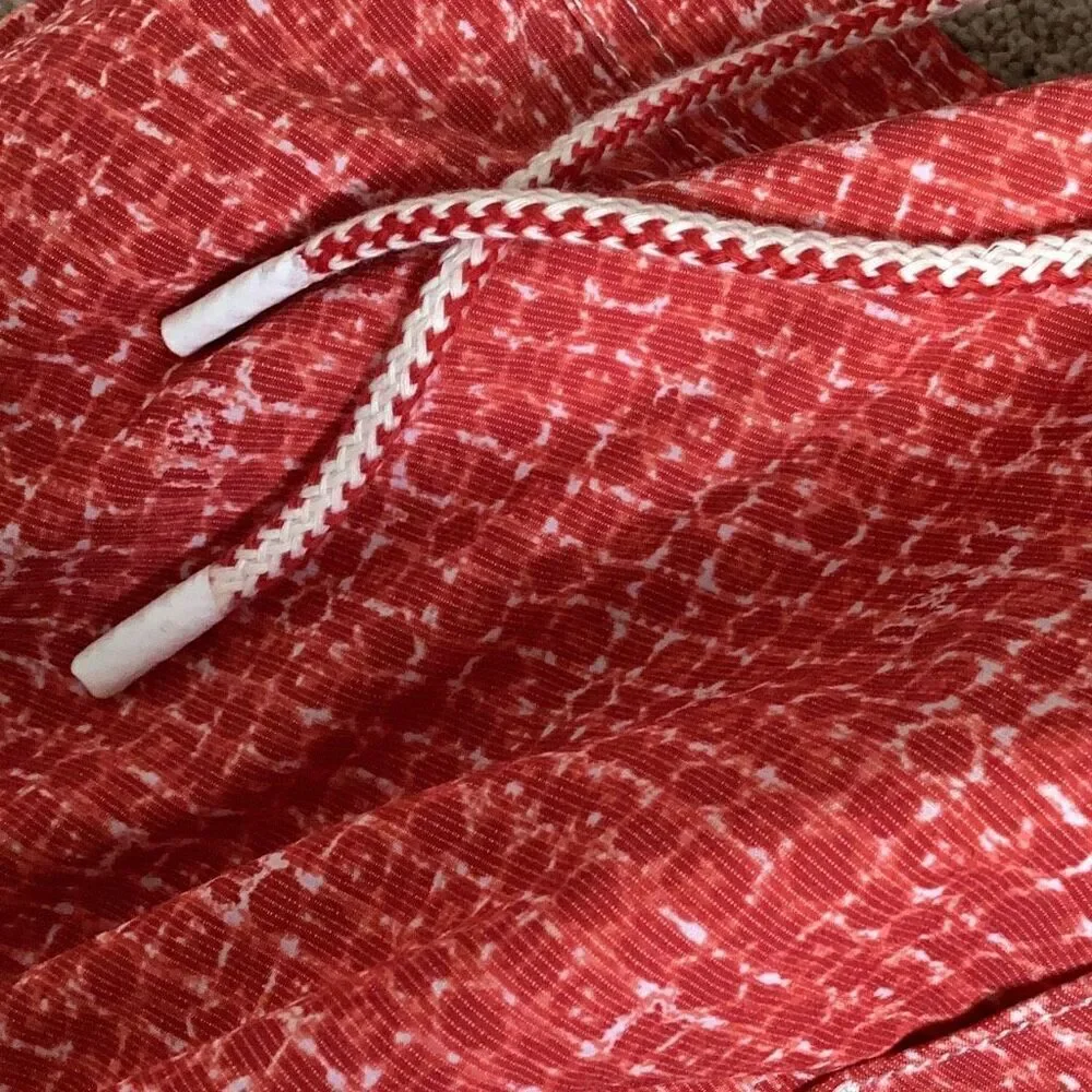 New. Johnnie-O red swim shorts. Small. Retails $89